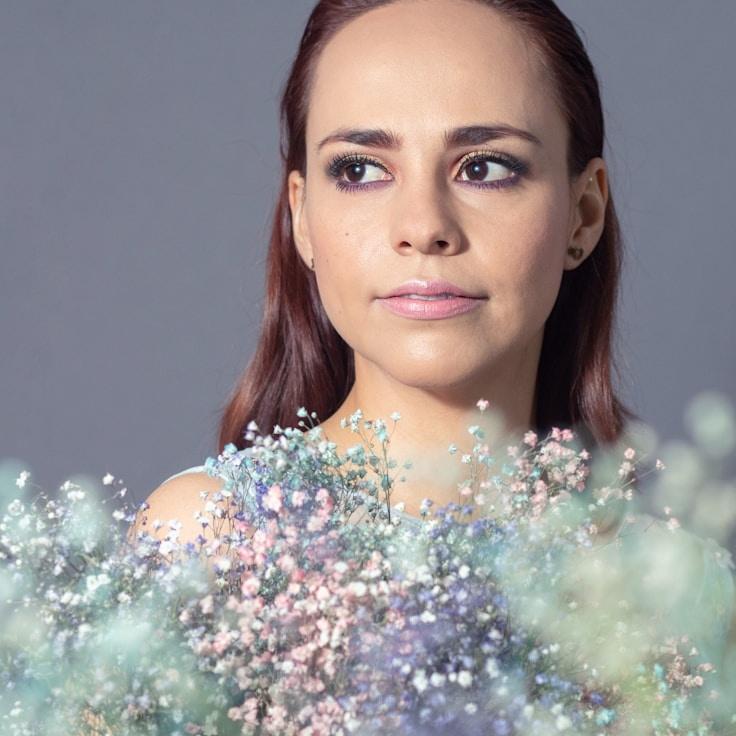 Kaveri Mehta, Lead Design Curator at Lumin Ariv Ortex, reviewing corporate floral arrangements